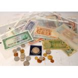 Collection of world banknotes and coins. Many in uncirculated condition