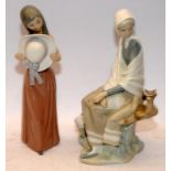 Two Lladro figurines, Shepherd Lady Watching Bird and Bashful Girl With Hat. Largest figure 26cms
