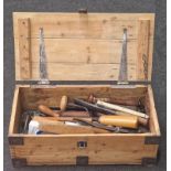 Wooden lidded box containing a collection of vintage carpenters work tools.