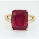 A 9ct Gold Ladies Ruby Solitaire Ring. 8.5ct Cushion cut African Ruby, in open work setting, Size L