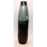 A large and heavy inert artillery shell. 43cms tall