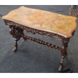 Victorian Walnut hall table having embossed decoration to supports and twisted centre cross bar