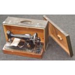 Singer hand driven sewing machine in carry case model no EB699703