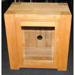 Contemporary solid oak entertainment unit with glazed hinged door including three glass shelves.