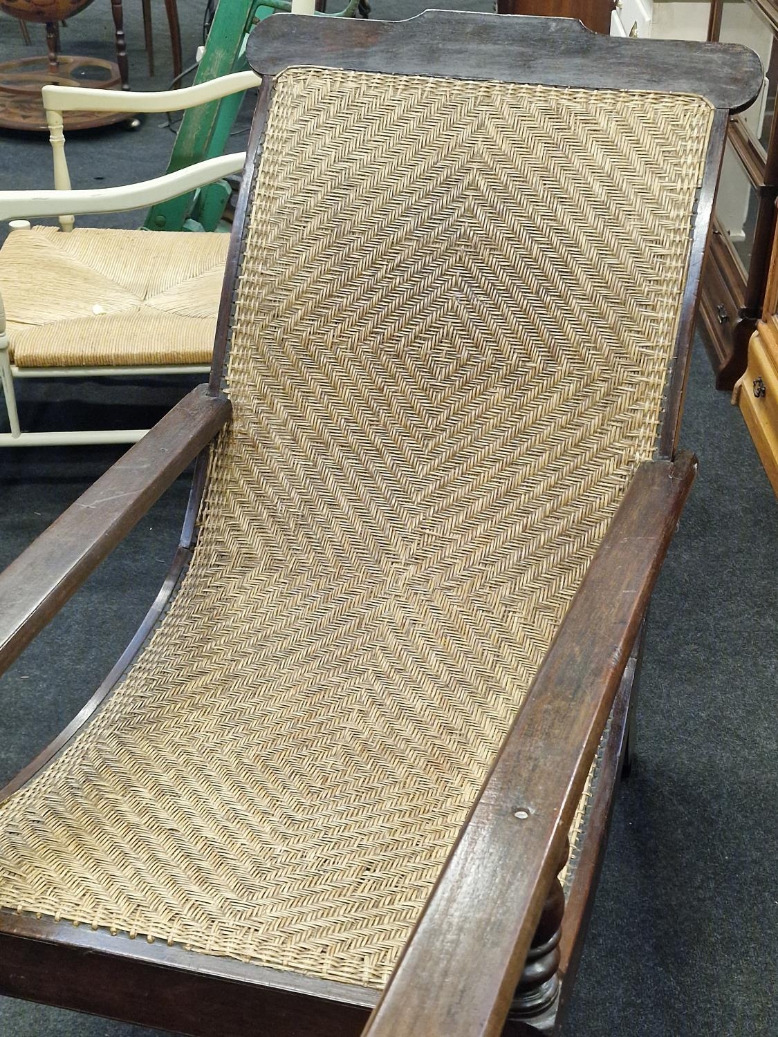 Anglo Dutch colonial Plantation chair with arm extenders on turned supports with a woven back rest - Image 2 of 5