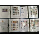 Four albums of world stamps.