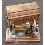 Singer hand driven sewing machine in carry case model no 15604307