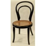 Antique French bentwood child's chair with casne seat in the Thonet style.