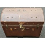 Dome top travel trunk with fitted separate shelf with twin carry handles and bras s attachments