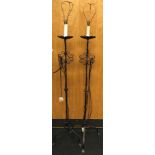 Pair of vintage cast metal standard lamps each measuring 173cm tall.