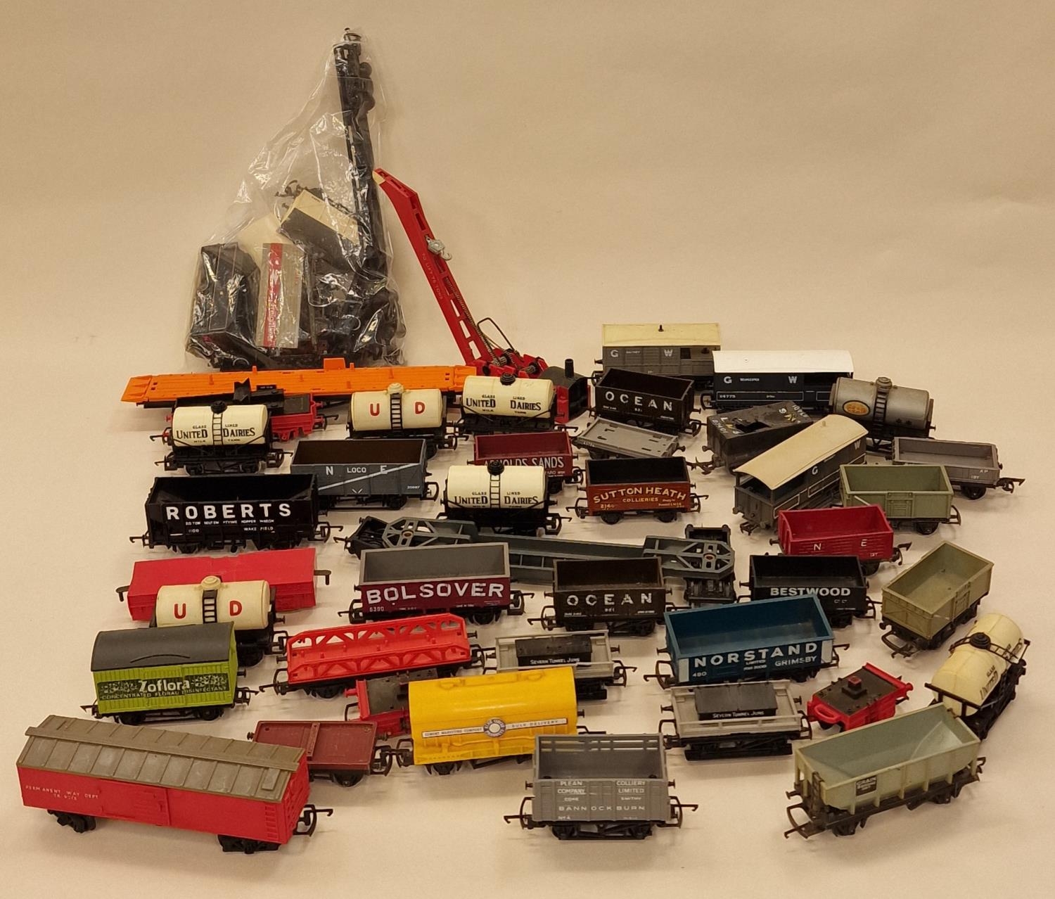Large collection of unboxed OO Gauge wagons and rolling stock.