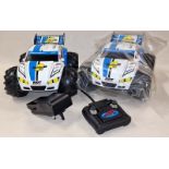 Nikko R/C Vaporizer 2 pair of cars with a remote and battery charger.