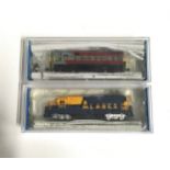 2 Bachmann N Scale Diesel locomotives: 61453 H16-44 Canadian Pacific and 63598 GP-40 Alaska. Both