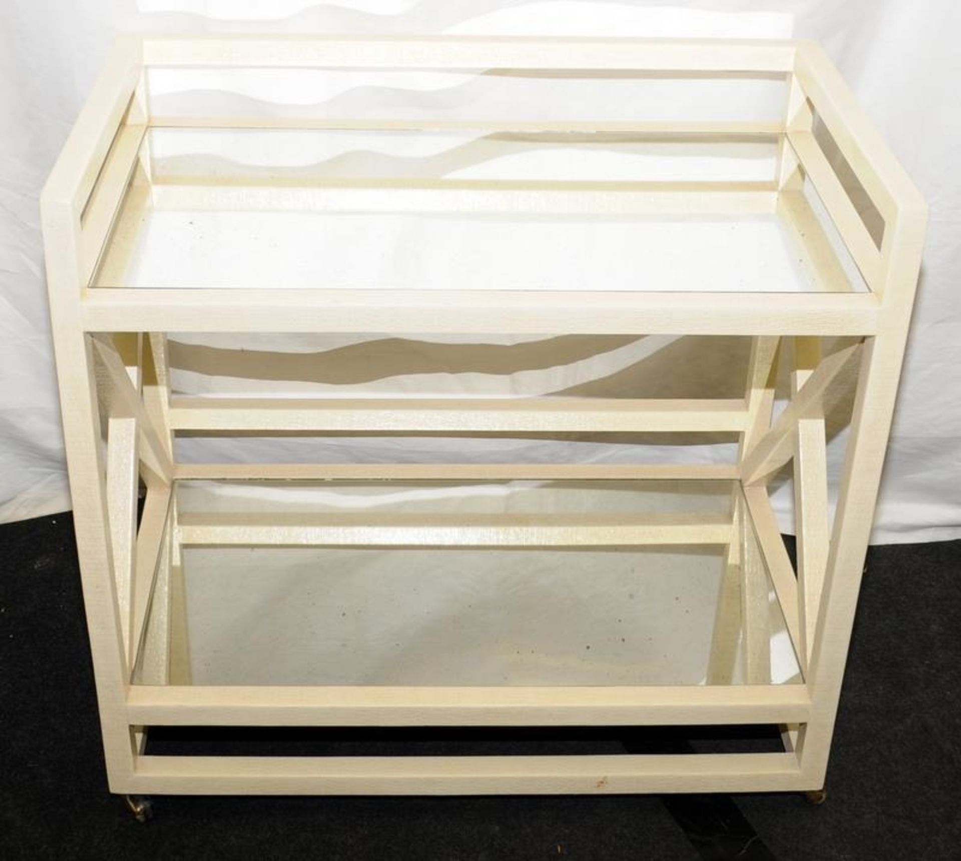 Contemporary cream finished wood framed two tier drinks trolley on castors with mirrored shelves