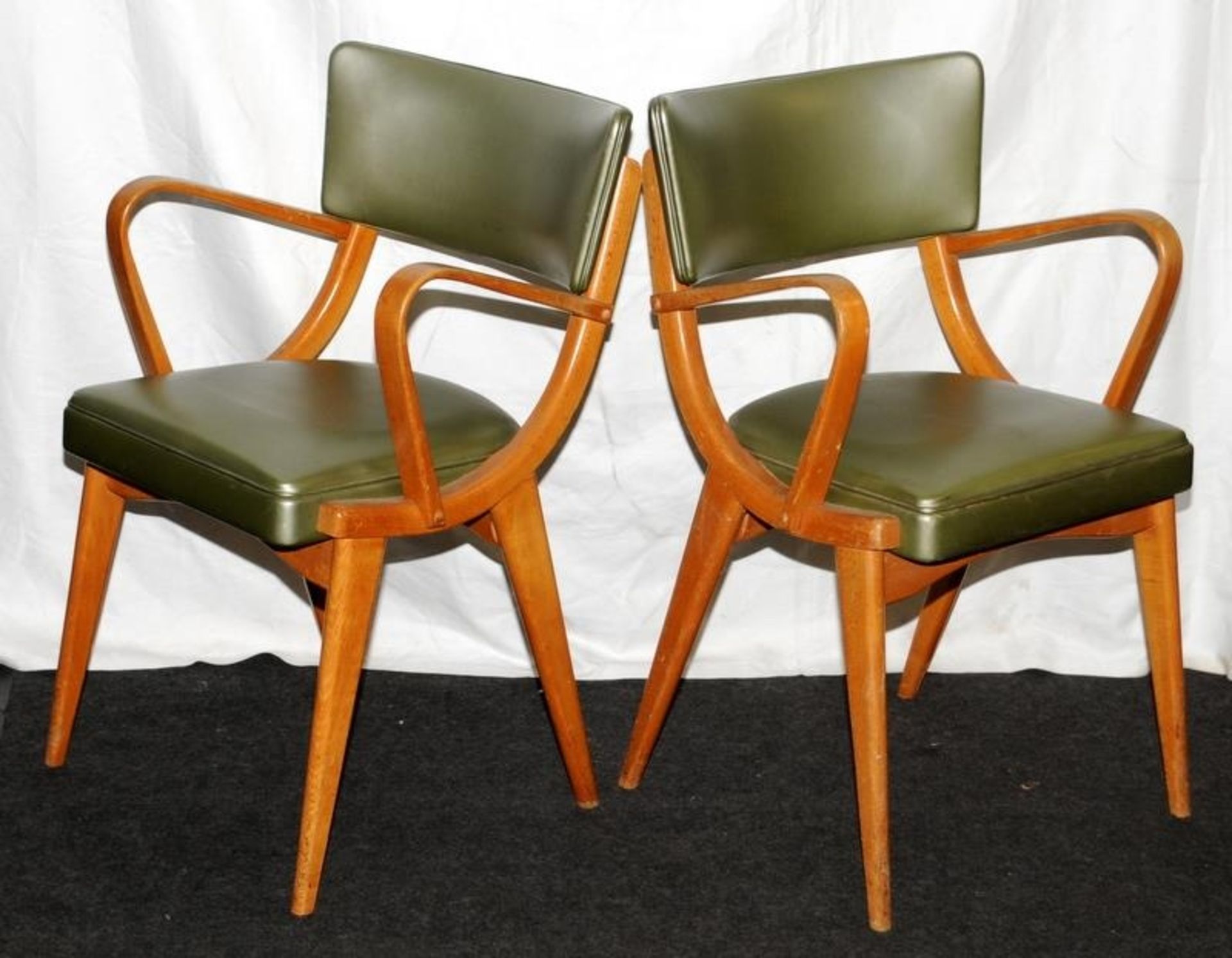 Pair of mid century Ben Chairs olive vinyl covered bent wood carver chairs. Seat height 46cms