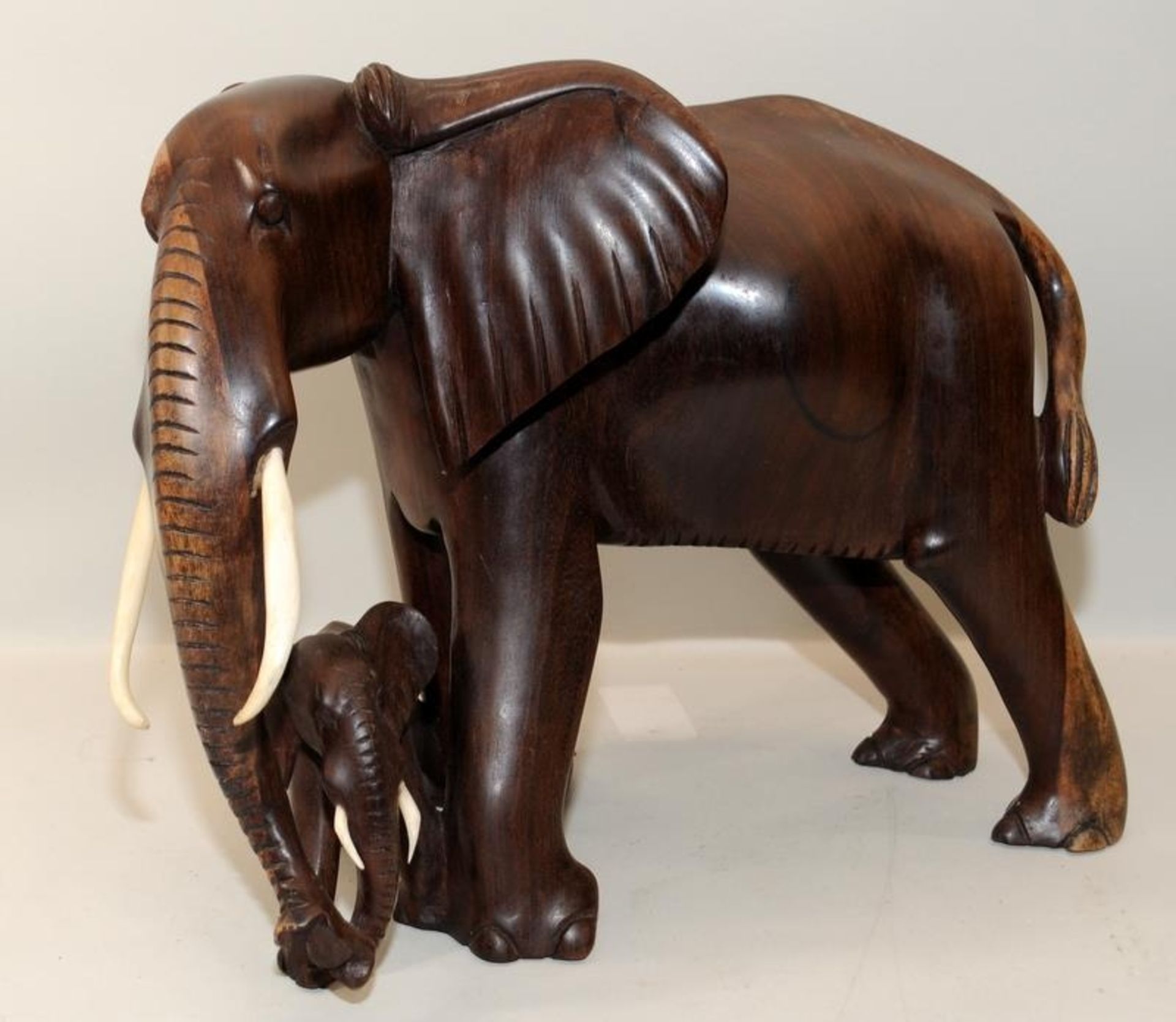 Large wooden carved elephant with calf standing 32cms tall