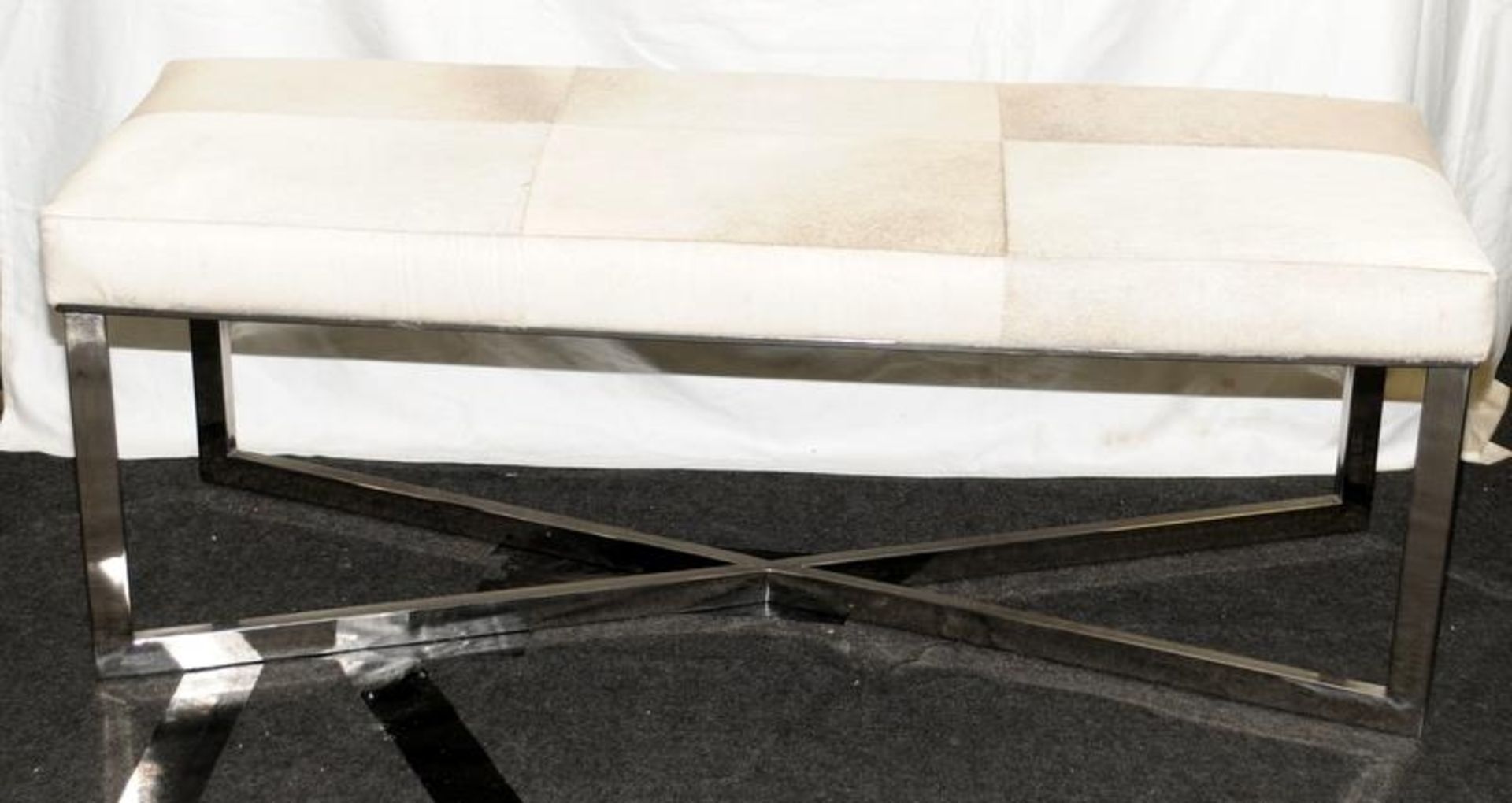 Contemporary bench featuring a padded cowhide seat on a chrome frame with 'x' stretcher. 50cms