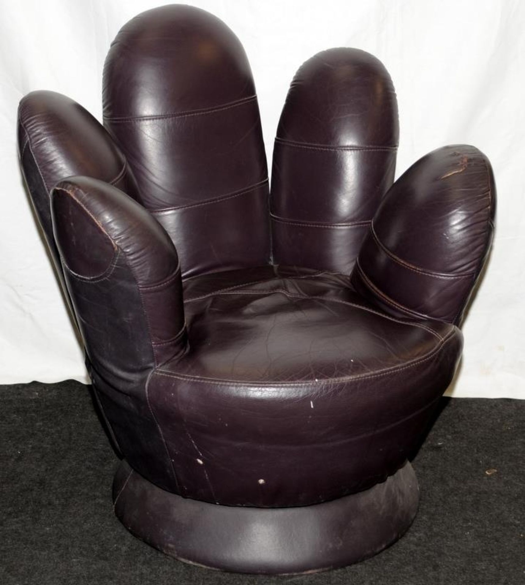 Revolving chair in the form of a hand in dark burgundy leather 90x80cm