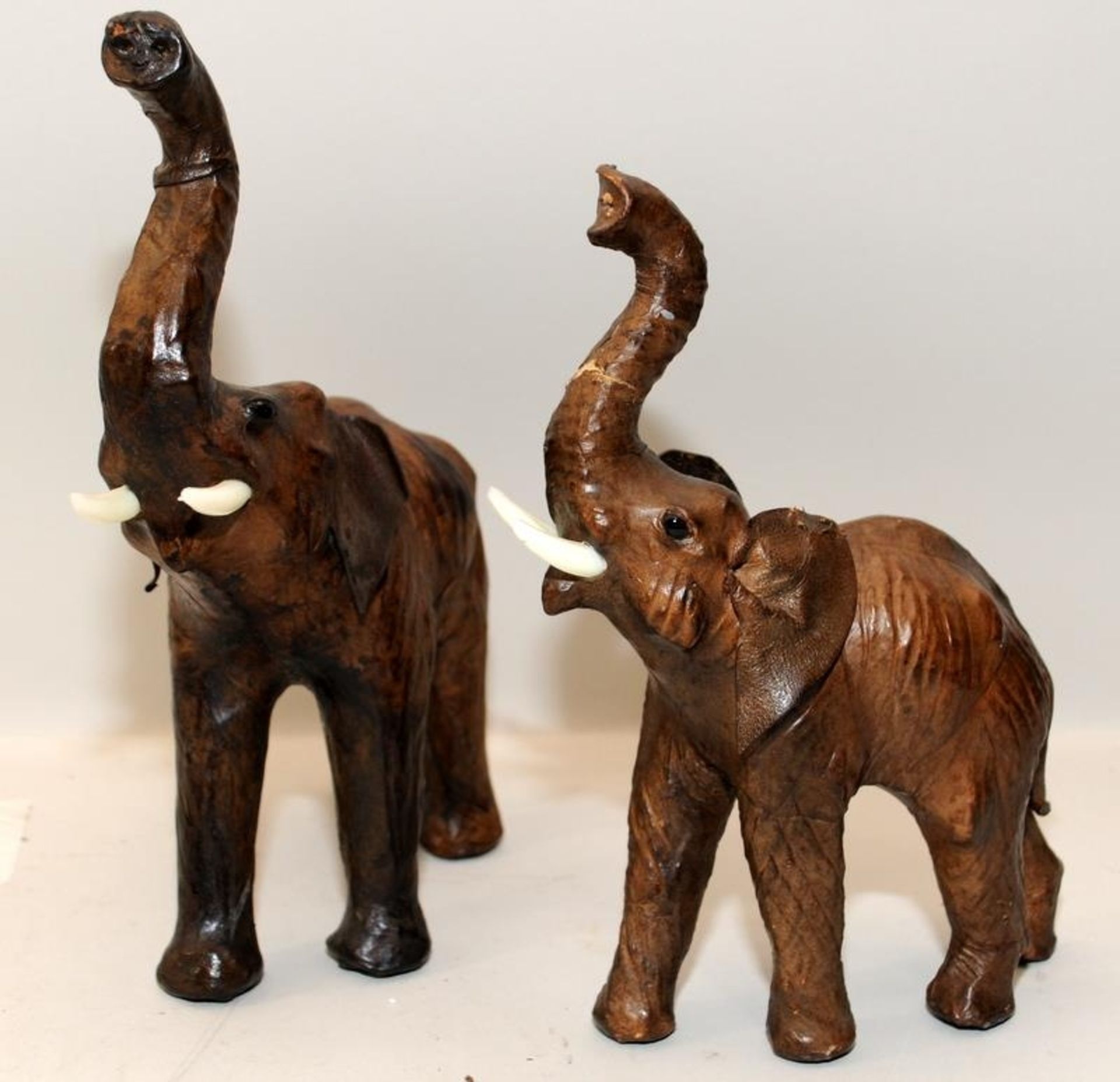 Pair of leather wrapped wooden elephants created for and retailed by Liberty's of London. Larger