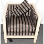 Contemporary solid wood framed armchair of square form with faux shagreen light brown finish. Seat