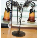 Mid Century two branch cast metal table lamp with glass shades and decorated with grapes and