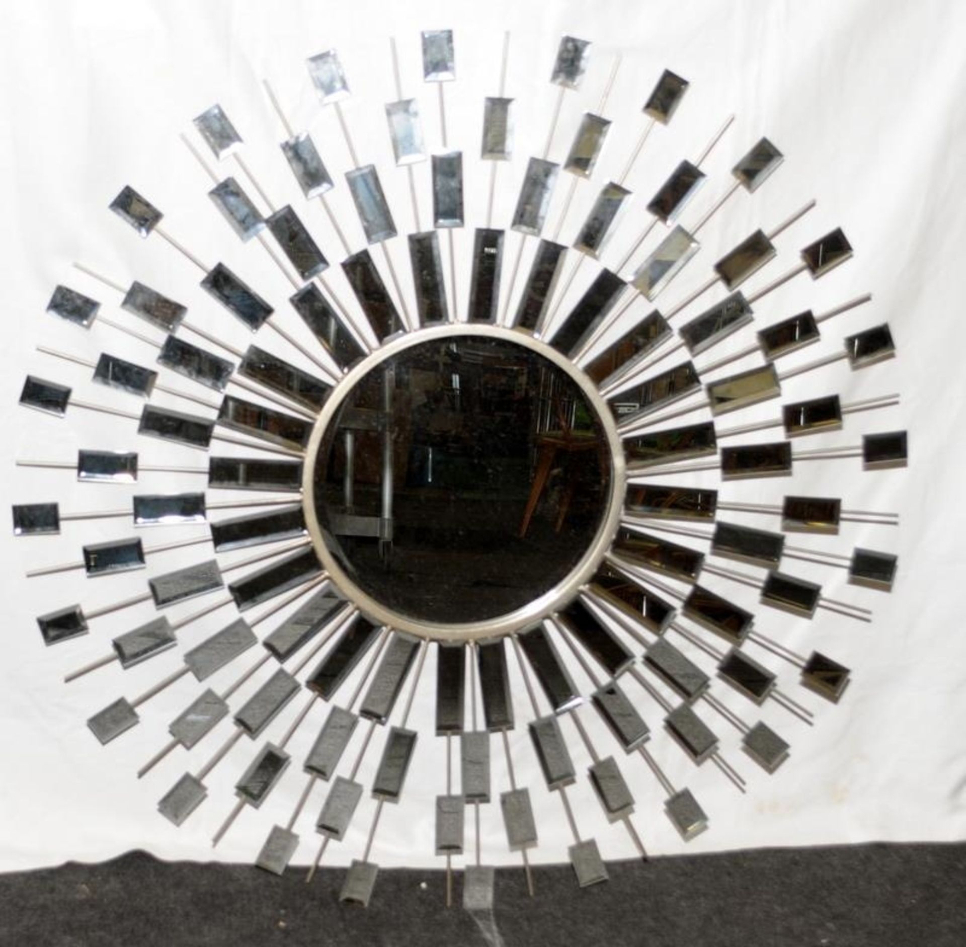 Large starburst wall mirror. 105cms across