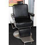 Genuine vintage dentists chair in black vinyl with chrome base.