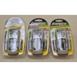 Three Energizer rechargeable battery chargers and batteries in sealed packets.