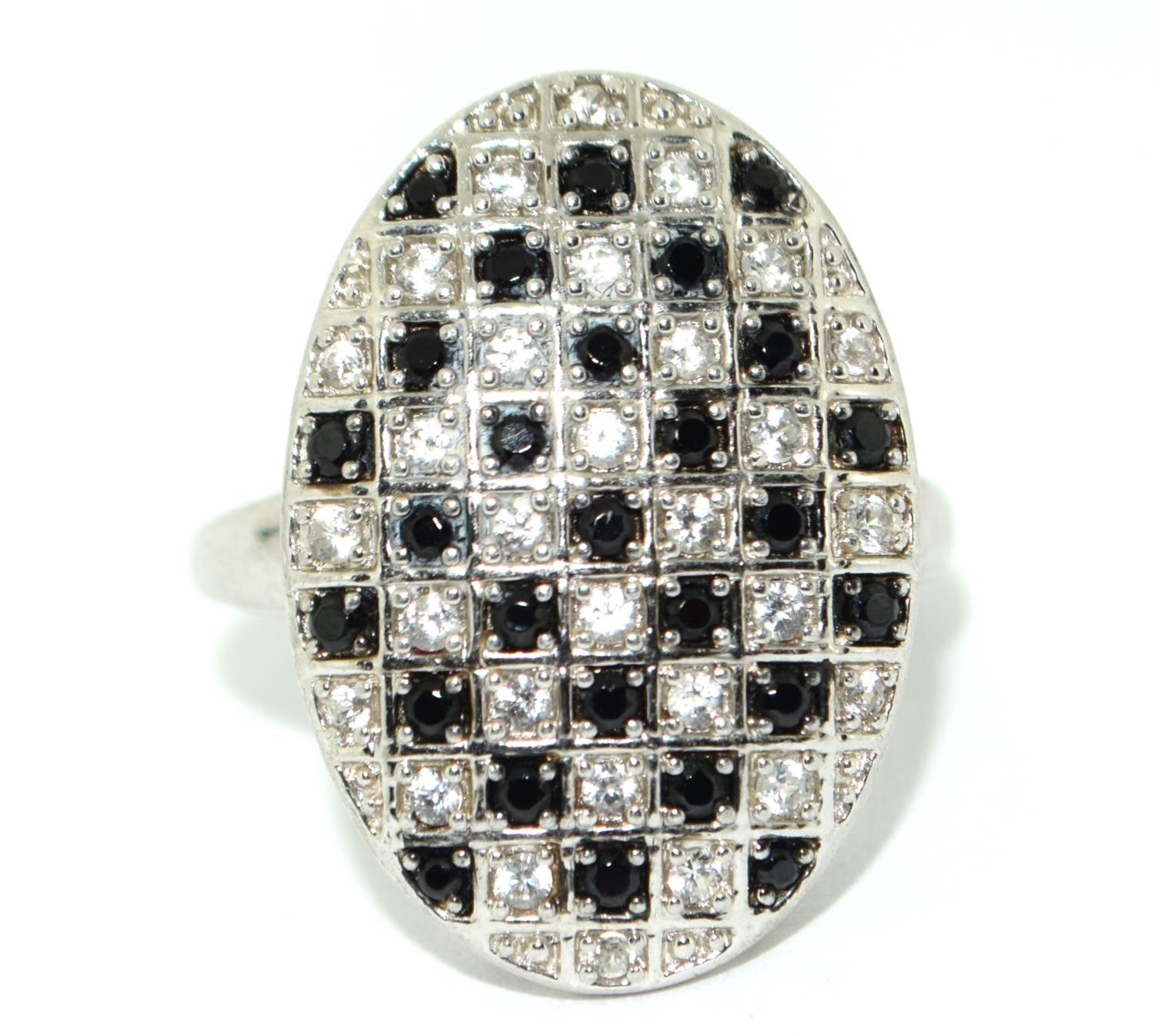 A large oval black and white stone 925 silver ring Size O