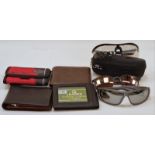 Collection of gents wallets together with three pairs of sunglasses.