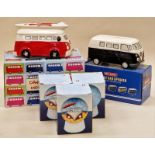 A collection of VW camper vans to include money boxes, speaker and water globe ornaments.