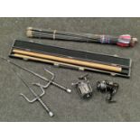 Collection of sporting items to include boxed snooker cue and two fishing reels.