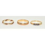 2 x 9ct gold wedding bands together a 14ct gold sapphire ring