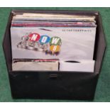 Small carry case of LP records together with some singles.
