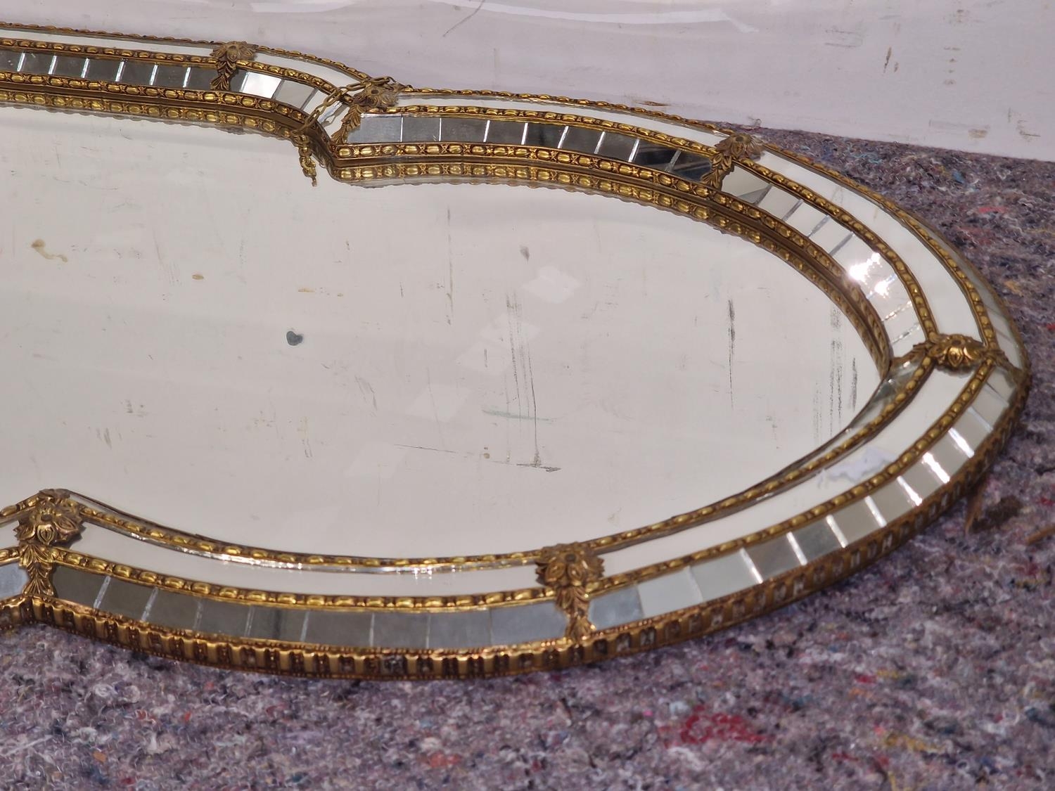 Moorish style gilt frame mirror set with cushioned mirror tiled edging in a contemporary shape - Image 2 of 3