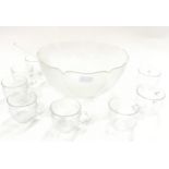 A glass punch bowl set.