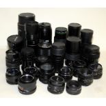 A large collection of 35mm camera lenses. Various sizes and mounts.