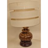 Mid 20th century West German lava pottery table lamp with shade.