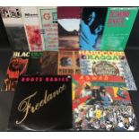 12 ASSORTED REGGAE RELATED VINYL LP RECORDS. Artists here include - Peter Tosh - Bob Marley -