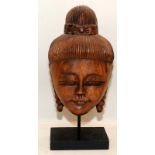 Vintage fine carved Buddha head bust mounted on wooden plinth. 36cms tall