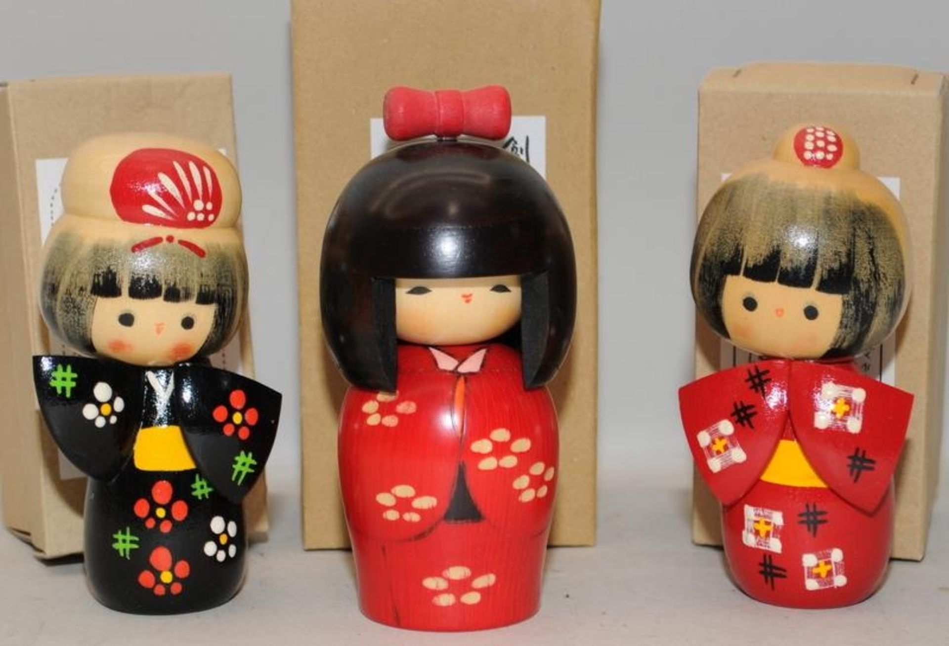 Japanese Kokeshi wooden dolls with boxes. Three in lot