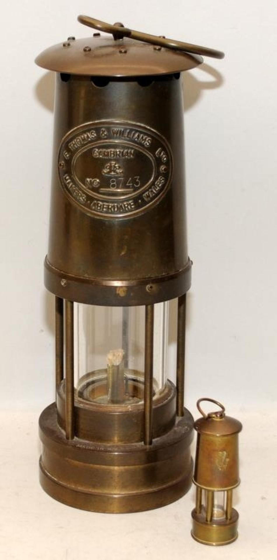 E Thomas & Williams Aberdare brass miners lamp c/w a vintage miniature example