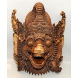 Vintage carved wood Balinese grotesque dragon mask approx 48cms tall. A few small losses.