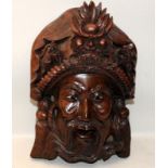 Vintage Oriental carved Rosewood wall hanging face mask. 40cms tall