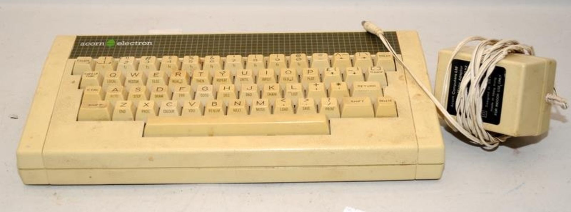 Vintage computing: 1982 Acorn Electron home computer c/w power lead. Offered untested