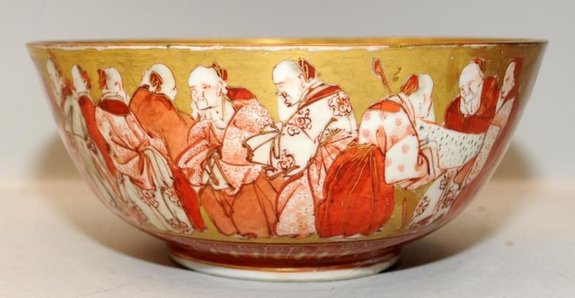 Japanese Kutani red and gold bowl featuring the Immortals. With repairs. 21cms across - Image 3 of 4