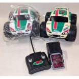 Nikko pair of NRT 598 R/C cars with a controller and battery charger.