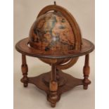 Vintage wooden Italian rotating globe of the world of small proportions approx 40cm tall.