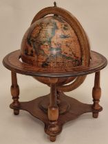 Vintage wooden Italian rotating globe of the world of small proportions approx 40cm tall.