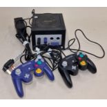 Nintendo Gamecube console with power supply and two controllers. This lot has not been tested.